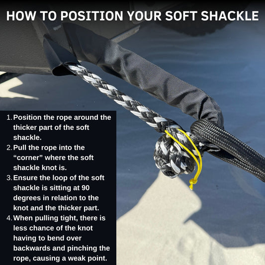 Braided soft shackle with black webbing loop and yellow tie, close-up