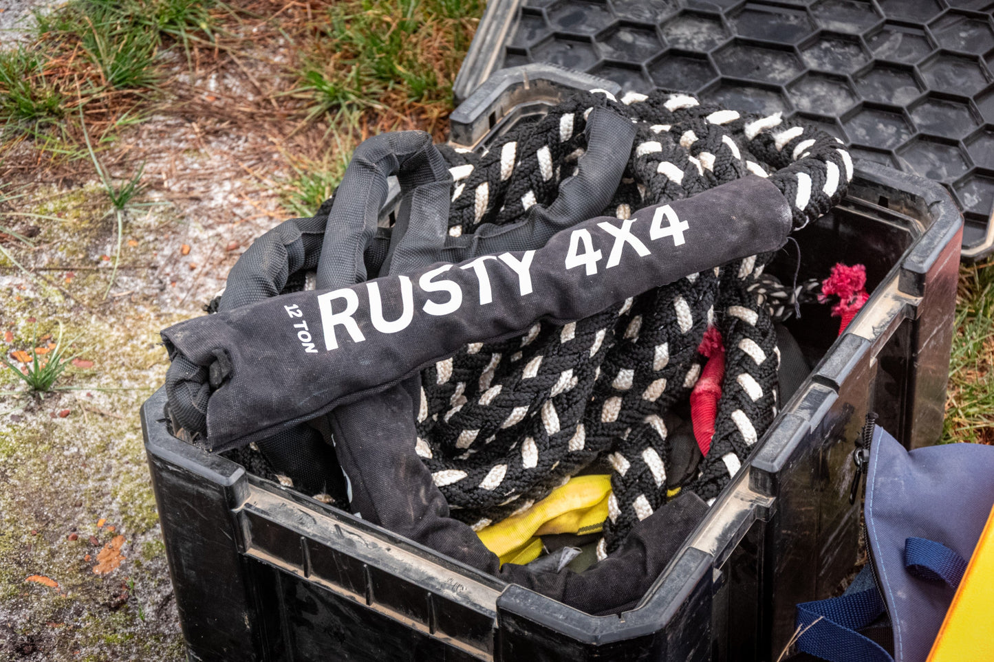 Recovery kit case open with black recovery strap and red hook