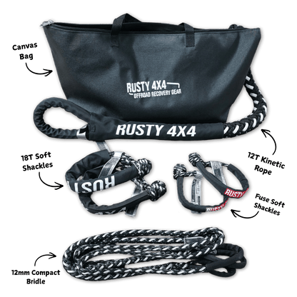 Off-road recovery kit with dark duffel bag, straps, shackles, and braided rope