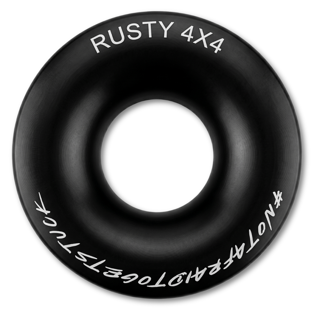 Black winch ring with central hole and white RUSTY 4X4 lettering around edge